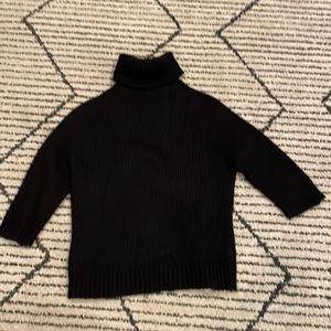 Medium black turtleneck by French Connection.